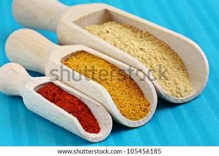 Close up of ground hot asian spices such as curry, paprika, ginger