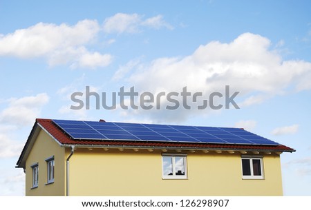Green Energy - Electricity generation with solar panels on the roof