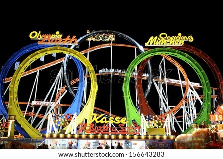MUNICH, GERMANY - SEPTEMBER 25: Roller coaster at the Oktoberfest in Munich, Germany on September 25, 2013. Oktoberfest is the biggest beer festival of the world with over 6 million visitors a year.