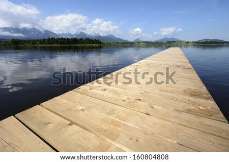 Wooden landing stage at the Hopfensee (Germany, Bavaria)