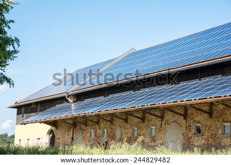 Green energy with solar panels on a old agricultural building