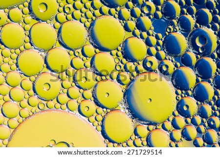 Colorful abstract macro background with oil drops in water