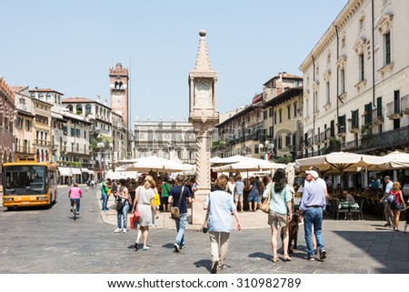 VERONA, ITALY - JUNE 3: Tourists at the Piazza delle Erbe in the historic center of  Verona, Italy on June 3, 2015. Verona is famous for its amphitheatre which could host more than 30,000 spectators.