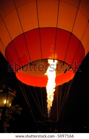 Hot air balloon glowing in the night.