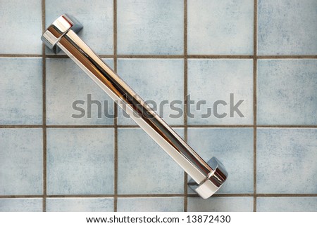 Handicap Bathroom on Bathroom Wall With Blue Tiles And A Chrome Handle Stock Photo 13872430
