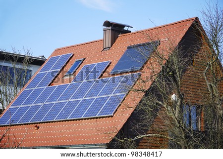 House roof with photovoltaics installation and solar heating system