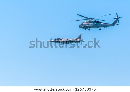 CADIZ, SPAIN-SEP 14: Aircraft AV-8B Harrier Plus and helicopter Seahakw SH-60B taking part in an exhibition on the 1st airshow of Cadiz on Sep 14, 2008, in Cadiz, Spain