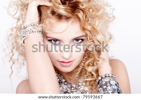 portrait of a beautiful female model on white background with diamond jewelry