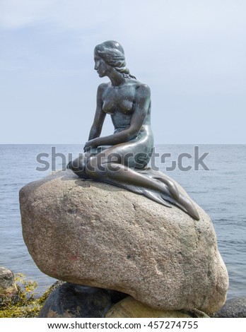 bronze statue located in Copenhagen in Denmark named The Little Mermaid