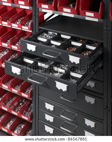full frame detail of a tool cabinet with open drawers