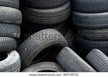 background with old tires on each other