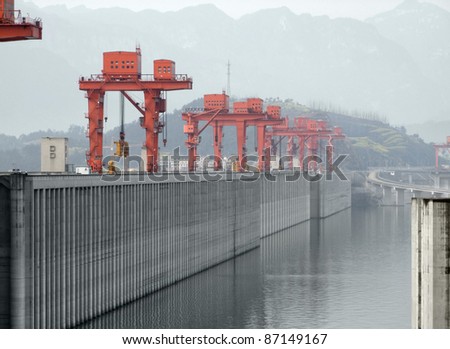 the Three Gorges Dam at Yangtze River in China in foggy ambiance