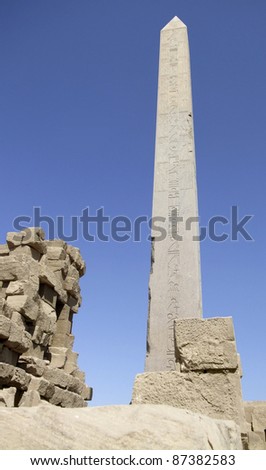scenery around Precinct of Amun-Re in Egypt showing the obelisk of Hatschepsut in front of clear blue sky