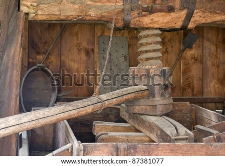 detail of a historic wooden wine press, seen in Alsace (France)