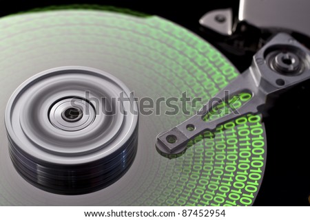 studio photography of a opened hard disk with symbolic data