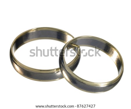 stock photo studio photography of two shiny metallic wedding rings on each