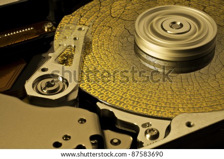symbolic data rescue theme showing a opened hard disk with symbolic corroded surface
