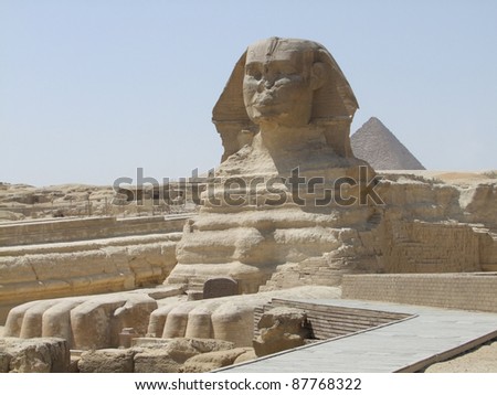 sunny scenery around Giza Necropolis in Egypt including the Sphinx in front of the Pyramid of Menkaure