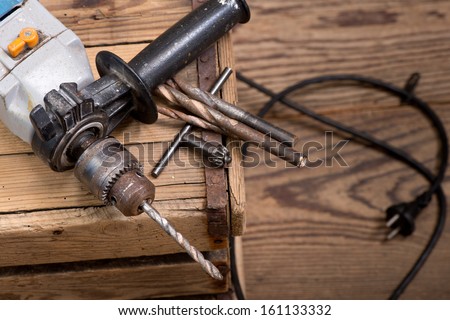 a still life with electric drill in workroom