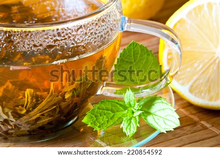 detail of tea cup with lemon and peppermint