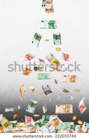 falling euro money on the gray background
