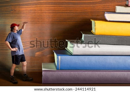climber climbs a heap of books, composite image