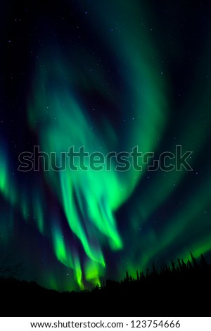 Northern Lights spread over the sky
