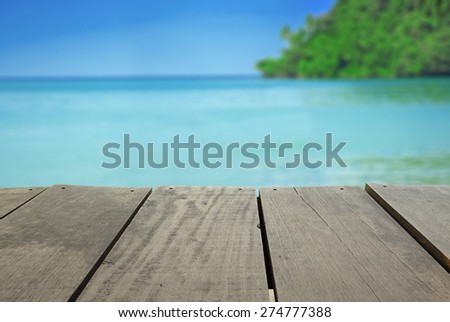 Defocused and blur image of terrace wood and beautiful seascape and sunset view for background usage