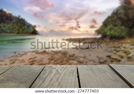 Defocused and blur image of terrace wood and beautiful seascape and sunset view for background usage