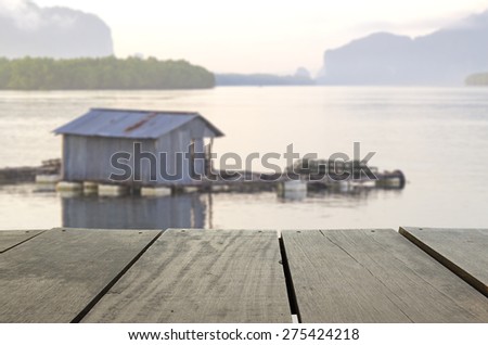 Defocus and blur image of terrace wood and Beautiful seascape in morning time for background usage