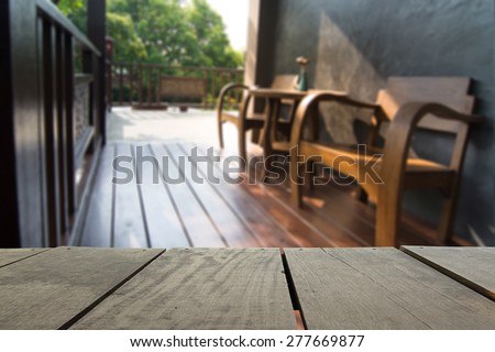 Defocus and blur image of terrace wood and Wooden terrace and classic chair for background usage for background usage