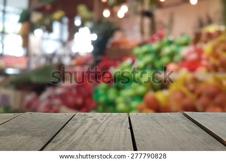 Defocus and blur image of terrace wood and Supermarket blur background in Fruits and Vegetables devision for background usage
