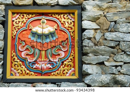 Bhutan Timber Logo bury in the stone wall