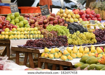Organic fruits and vegetables at an open street market.