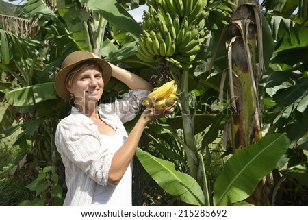 Agriculture: Woman visiting banana plantation