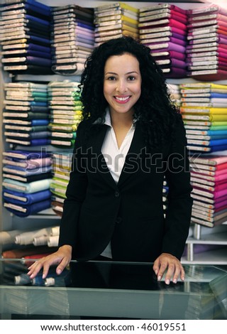 small business: happy owner of a fabric store