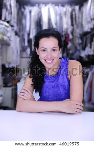 small business: happy owner of a dry cleaner store