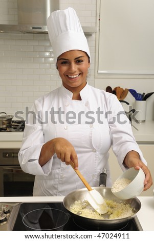 Chef cooking a tasty  risotto  in a modern kitchen
