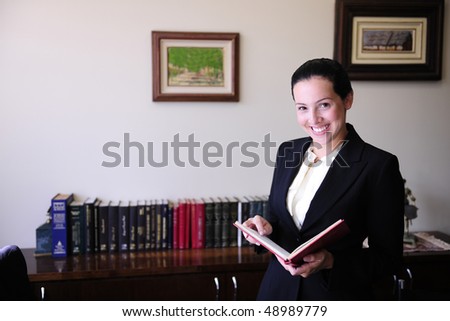 portrait of a female lawyer at office Remark for editors: Pictures on the wall were changed on Photoshop (no property release necessary)