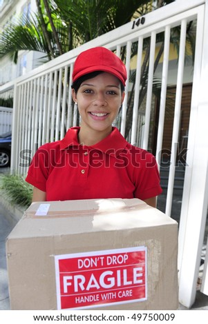 young delivery courier delivering package outdoors