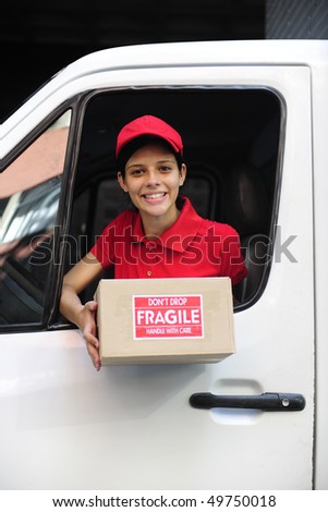 young delivery delivery courier in truck handing over package