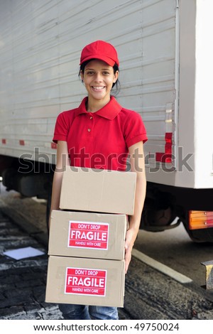 young delivery courier or mover delivering cardboards