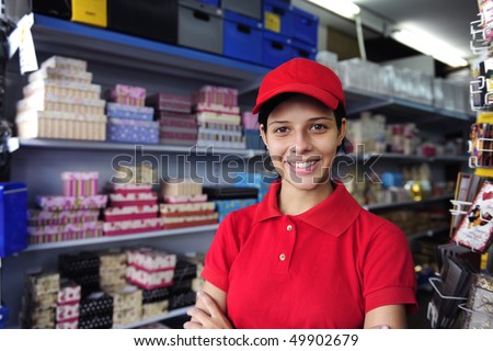 portrait of a salesgirl working  in  gift box store