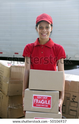 young delivery courier or mover delivering cardboards