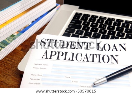 blank student loan application on desktop with books and laptop