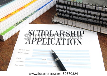 blank scholarship  application on desktop with books