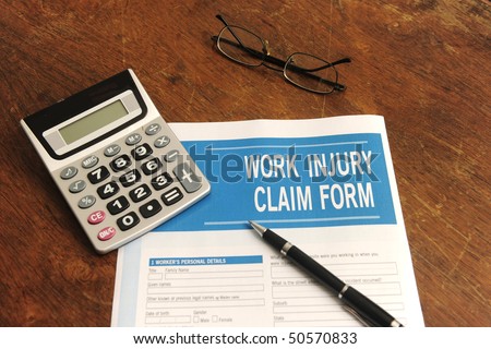 insurance: blank work injury claim form on desk
