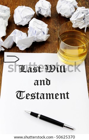 Last Will and Testament  and glass of whiskey on a wooden desk