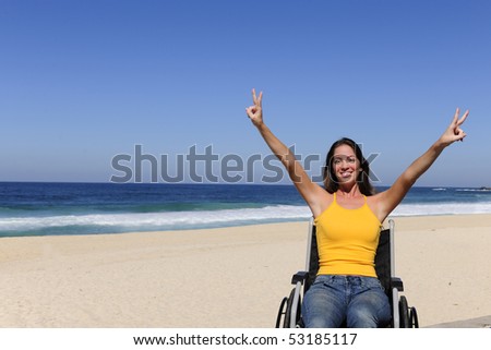 summer vacation: wheelchair person enjoying outdoors beach