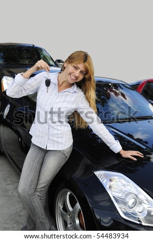 stock photo happy woman showing key of new sports car sports car keys